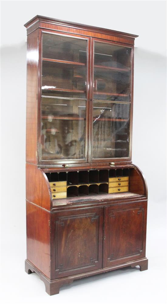 An early 19th century mahogany cylinder bureau bookcase, marked for T. Wilson, Great Queen Street, London, H.7ft 11in.